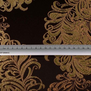 Ekskluzywny materiał obiciowy Diva z bogatym, błyszczącym złotym ornamentem na ciemnym tle zdjęcie z miarą