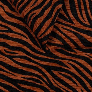 Zebra brązowo-czarna. Tkanina obiciowa we wzory zwierzęce Zebra brązowo-czarna – zbliżenie na strukturalny splot i tkany wzór materiału tapicerskiego